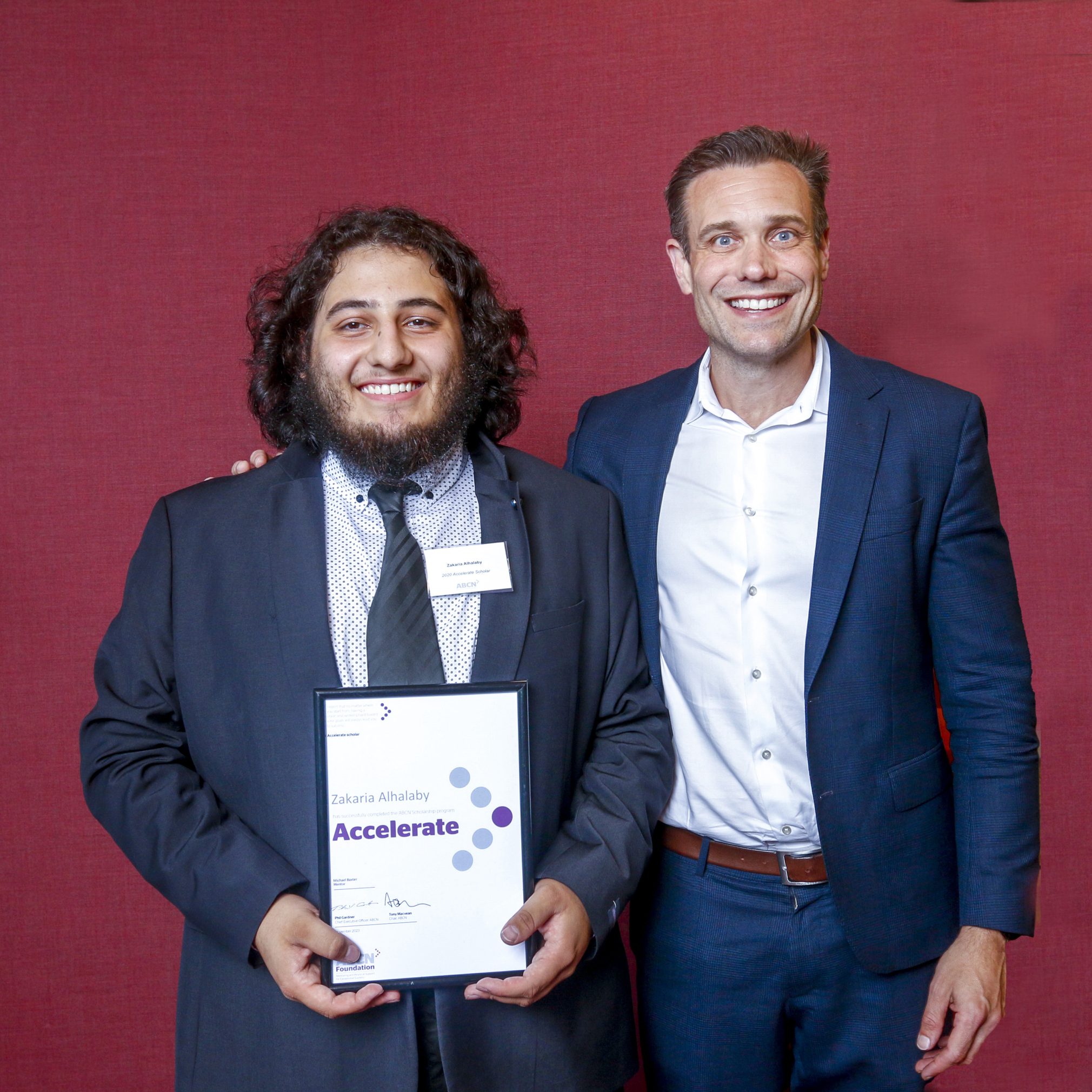 Zak pictured alongside his mentor, Michael Baxter from Optus.